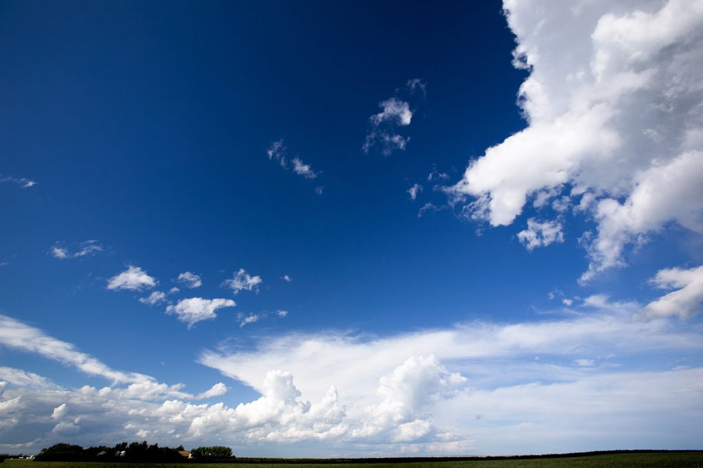 A landscape with a big sky with clouds.